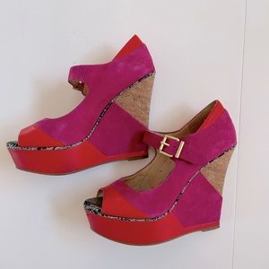 Pink & red-orange platform wedge heels with cork accents.